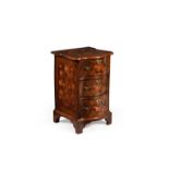 An unusual Dutch walnut and marquetry serpentine fronted chest