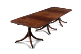 A George III mahogany triple pedestal dining table