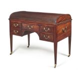 A George III mahogany and bronze mounted tambour top writing desk