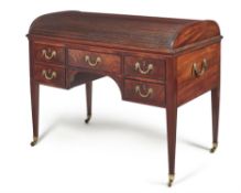 A George III mahogany and bronze mounted tambour top writing desk