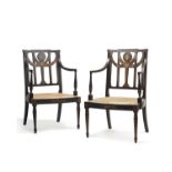 Another pair of George III ebonised and painted open armchairs