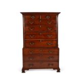A George III solid walnut chest on chest