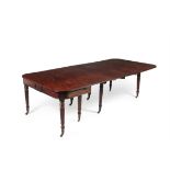 A Regency mahogany concertina action extending dining table