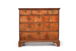 A George I walnut and crossbanded chest of drawers