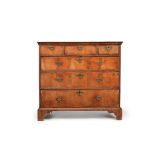 A George I walnut and crossbanded chest of drawers