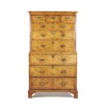 A George II walnut, burr walnut and feather banded secretaire chest on chest