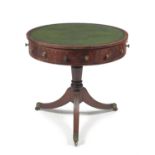 A Regency mahogany drum library table