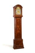 A George II burr walnut quarter-chiming eight-day longcase clock