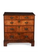 A George II walnut and crossbanded chest of drawers