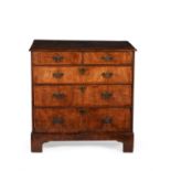 A George II walnut and crossbanded chest of drawers