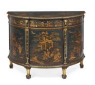 A dark green painted and gilt chinoiserie decorated demi-lune commode
