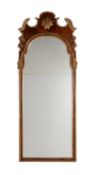 A walnut and parcel gilt wall mirror