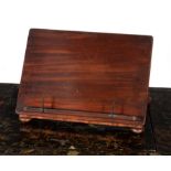 A George IV mahogany table top book rest, circa 1825, in the manner of Gillows