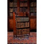 A Regency mahogany and ebony 'waterfall' bookcase