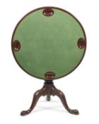 A George II mahogany tripod games table