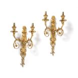 A pair of fine gilt bronze wall appliques to a design by Jean Hauré