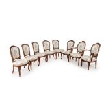 A set of eight Louis XV/Louis XVI transitional walnut and upholstered dining chairs