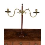 A George III mahogany and brass mounted height adjustable twin light candelabrum