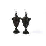A pair of fine French patinated bronze urns and covers