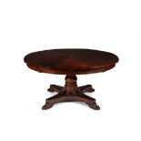 A mahogany circular concentric extending dining table