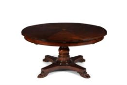 A mahogany circular concentric extending dining table