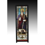 An impressive life-size French stained and leaded glass window panel depicting Saint Martin