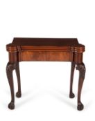 A George III mahogany triple folding games and tea table