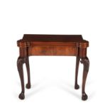 A George III mahogany triple folding games and tea table