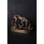 Prosper Lecourtier (French, 1855-1924), a patinated bronze model of a spaniel chasing a bird