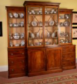 A George III mahogany breakfront library bookcase