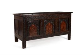 A Charles I carved oak and inlaid coffer
