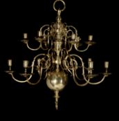 A companion pair of Dutch brass twelve light chandeliers