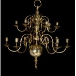 A companion pair of Dutch brass twelve light chandeliers