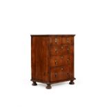 A Queen Anne walnut and featherbanded chest of drawers