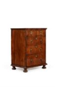 A Queen Anne walnut and featherbanded chest of drawers