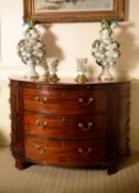 A George III mahogany and crossbanded semi elliptical commode