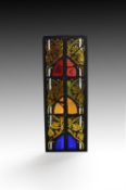 Three assorted fragments of stained glass in Gothic style