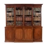 A mahogany breakfront library bookcase, in George III style