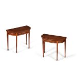 A pair of George III mahogany and satinwood folding card tables