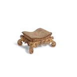 A carved giltwood and needlework upholstered foot stool