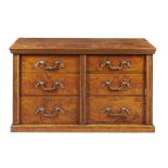 A George IV burr oak and gilt metal mounted chest of drawers