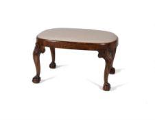 A walnut and upholstered stool, in George II style