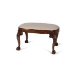 A walnut and upholstered stool, in George II style