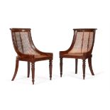 A pair of Regency mahogany library bergeres