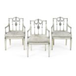 A set of three painted and parcel gilt open armchairs, circa 1790 and later re-painted