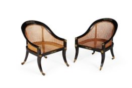 A pair of Regency ebonised and gilt metal mounted bergeres