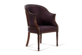 A George III mahogany and upholstered armchair