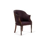 A George III mahogany and upholstered armchair