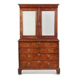 A George I figured walnut and feather banded secretaire cabinet