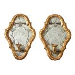 A pair of Italian carved giltwood and etched glass girandole wall mirrors